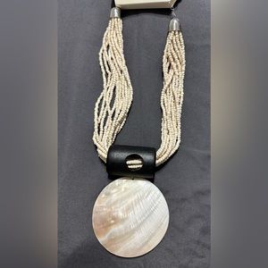 This beautiful shell necklace will make a statement